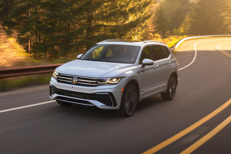 A VW SUV driving down a beautiful West Virginia mountain road